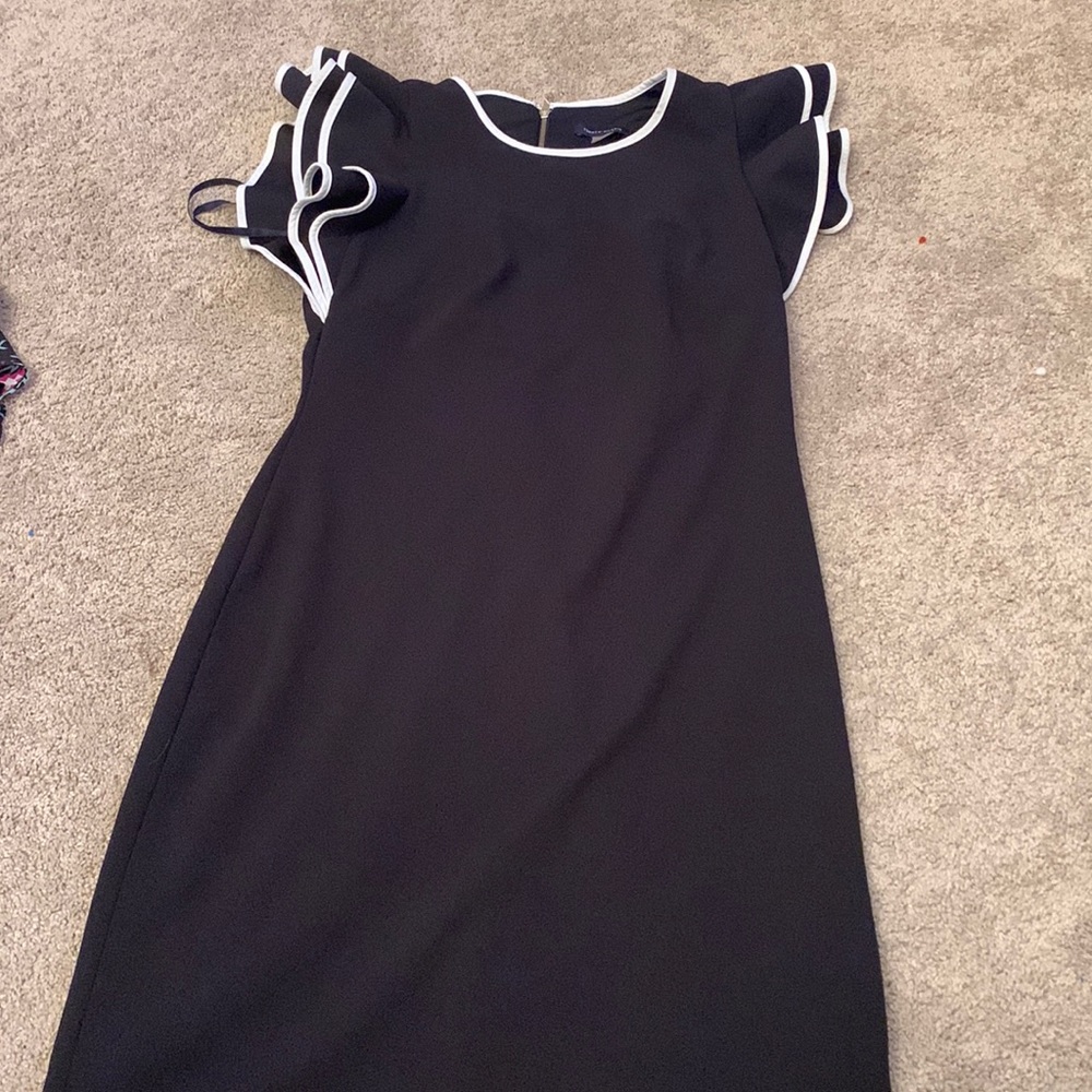 Black cocktail dress with white lined ruffle sleeves
